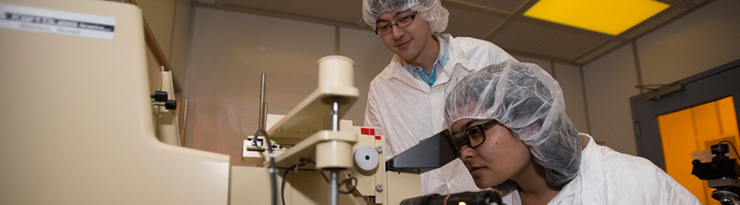 graduate students working in a clean lab