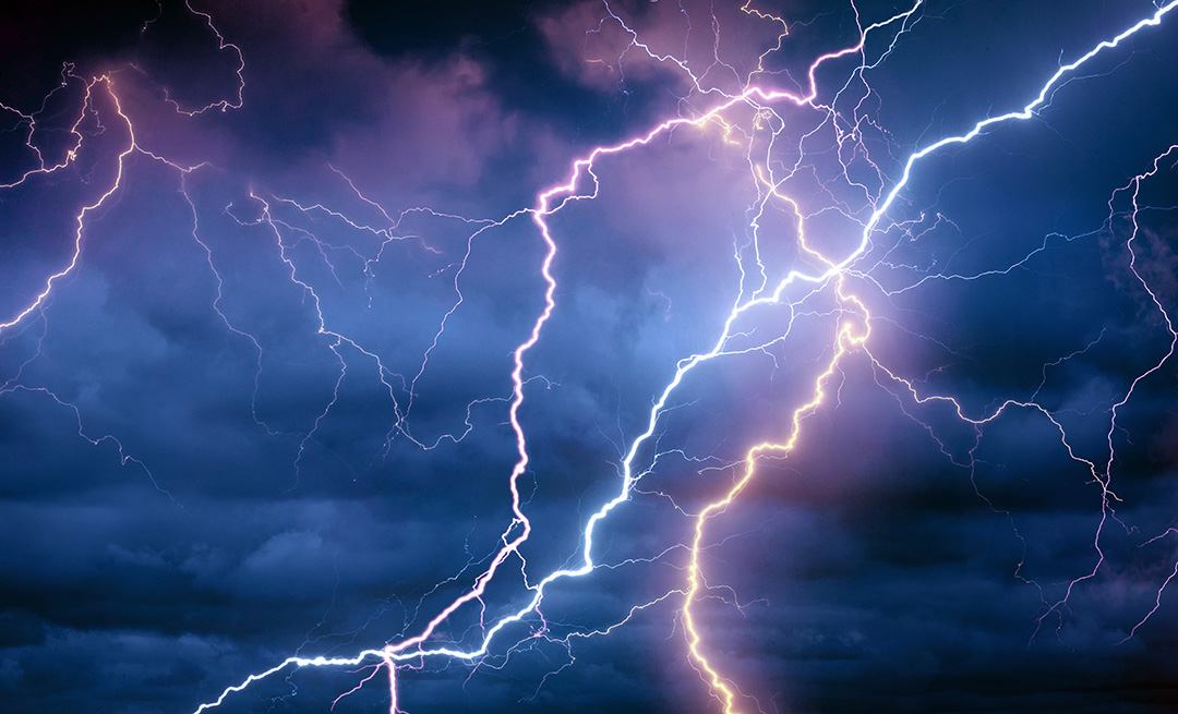 lightning against a blue-purple sky