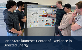 students viewing a poster presentation