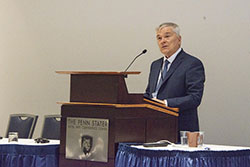 Eric Barron, President of Penn State, speaks at the podium