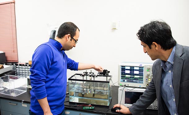 Hesam Sadeghi, an electrical engineering graduate student, and Mehdi Kiani, Dorothy Quiggle Assistant Professor of Electrical Engineering, test the ultrasound technology.