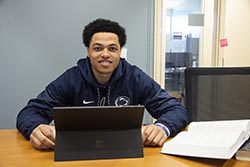 A student works on his laptop